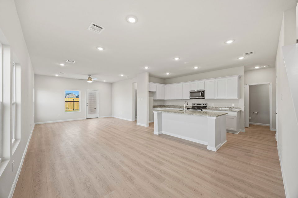 A large kitchen with white cabinets.