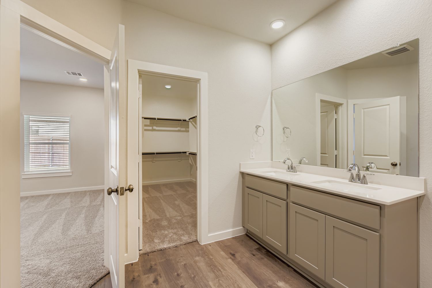 A bathroom with a sink and a shower.