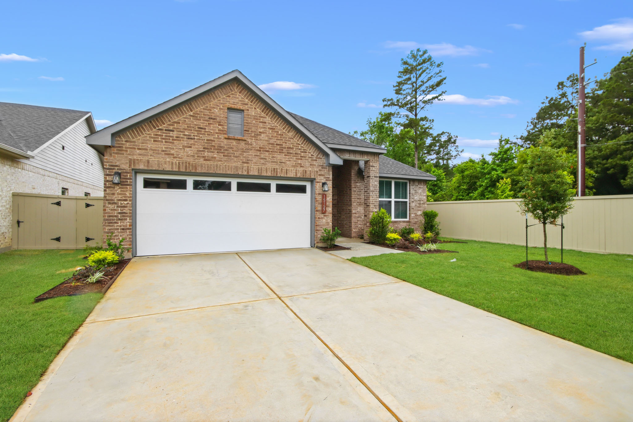 A driveway leading to a house.