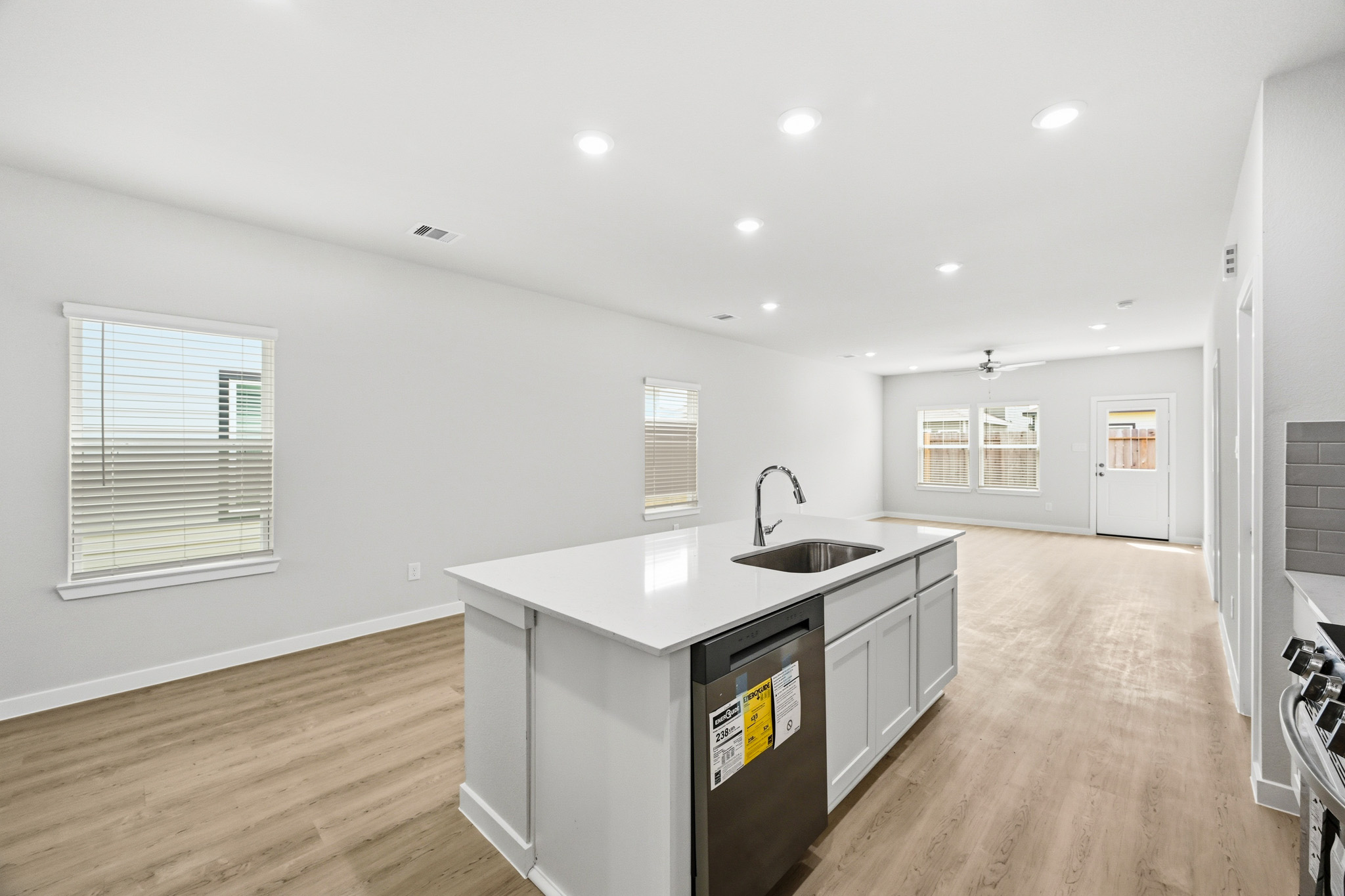 A kitchen with white walls.