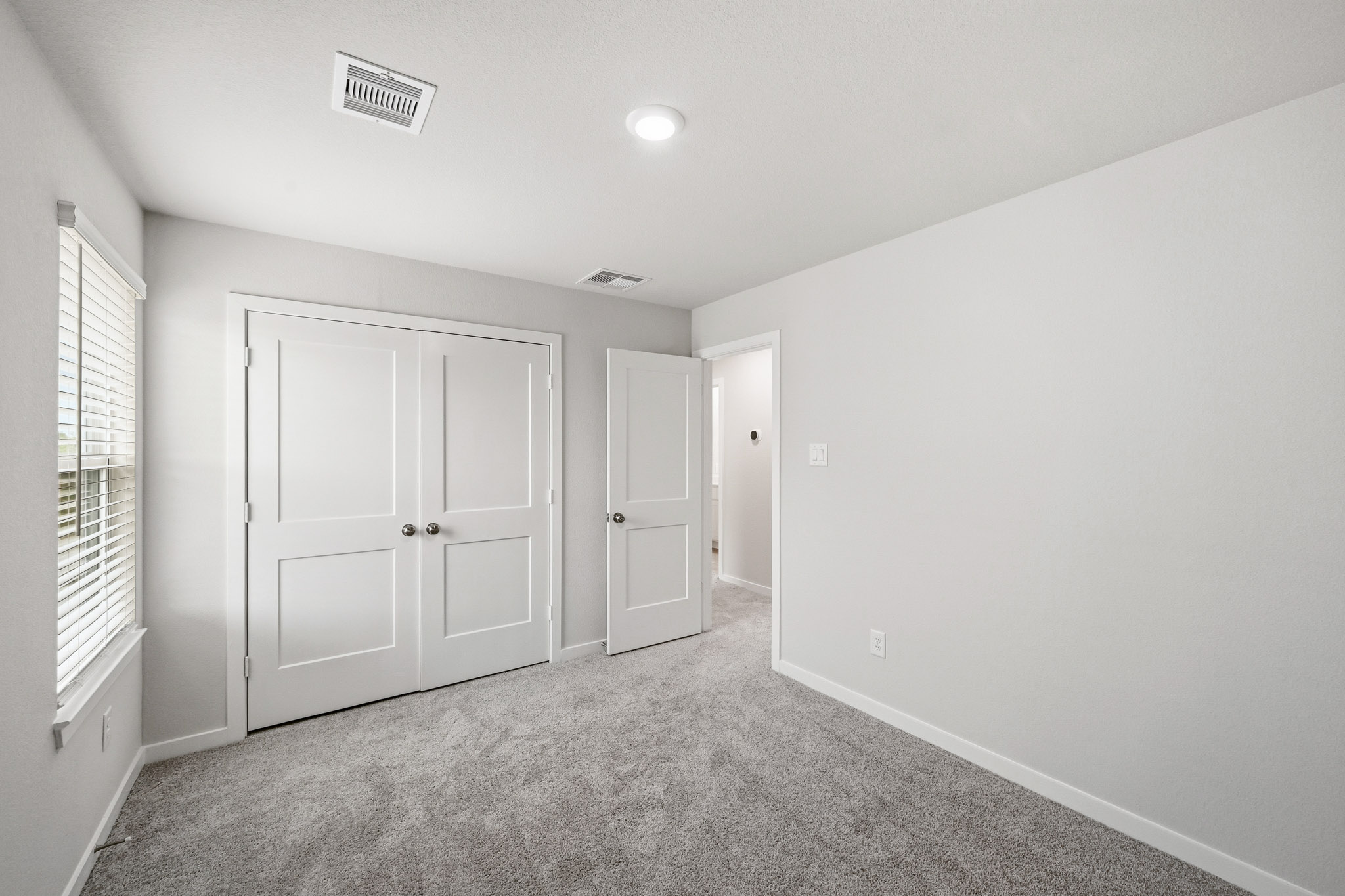 A room with white doors.