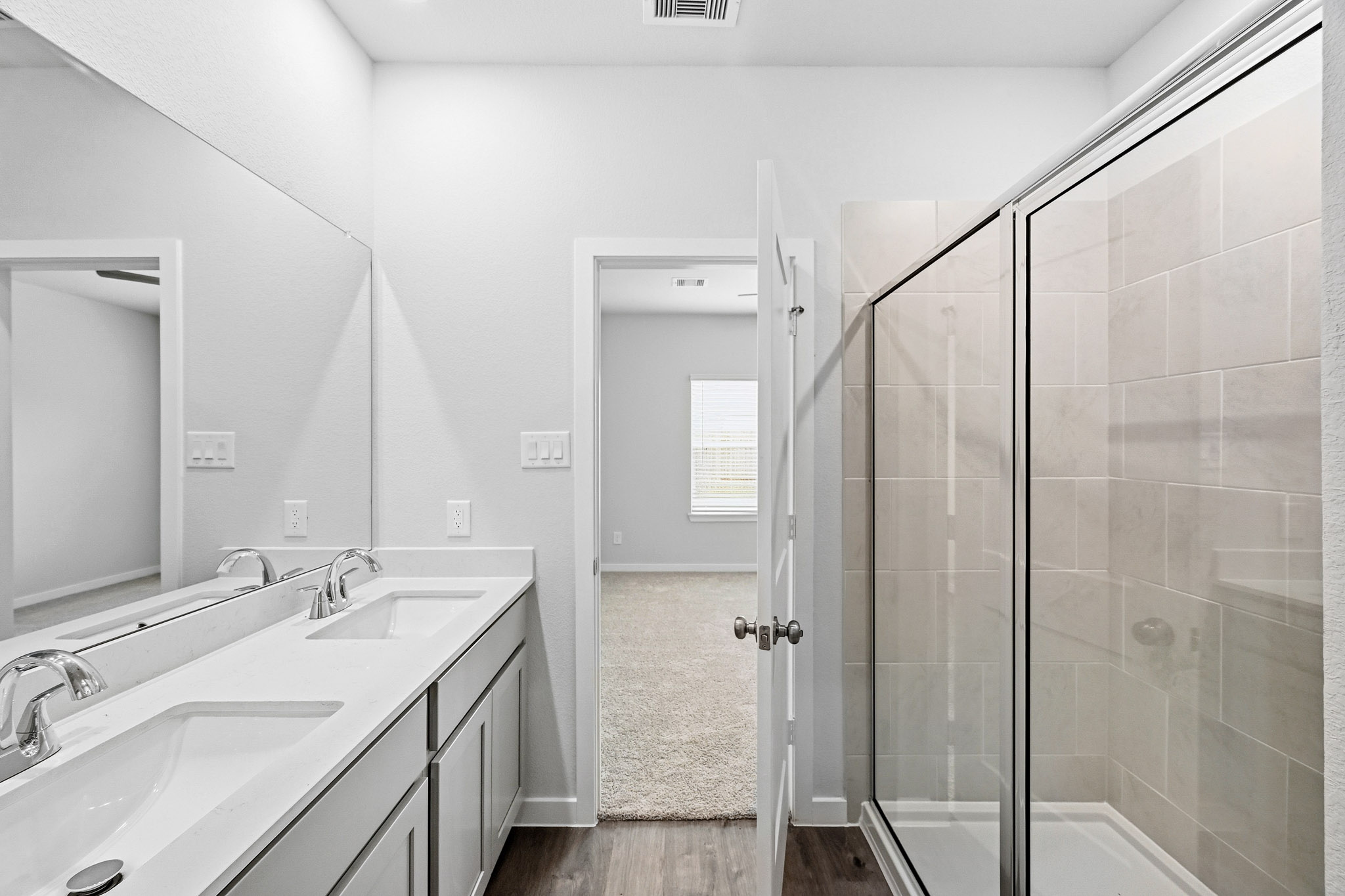 A bathroom with a glass shower.