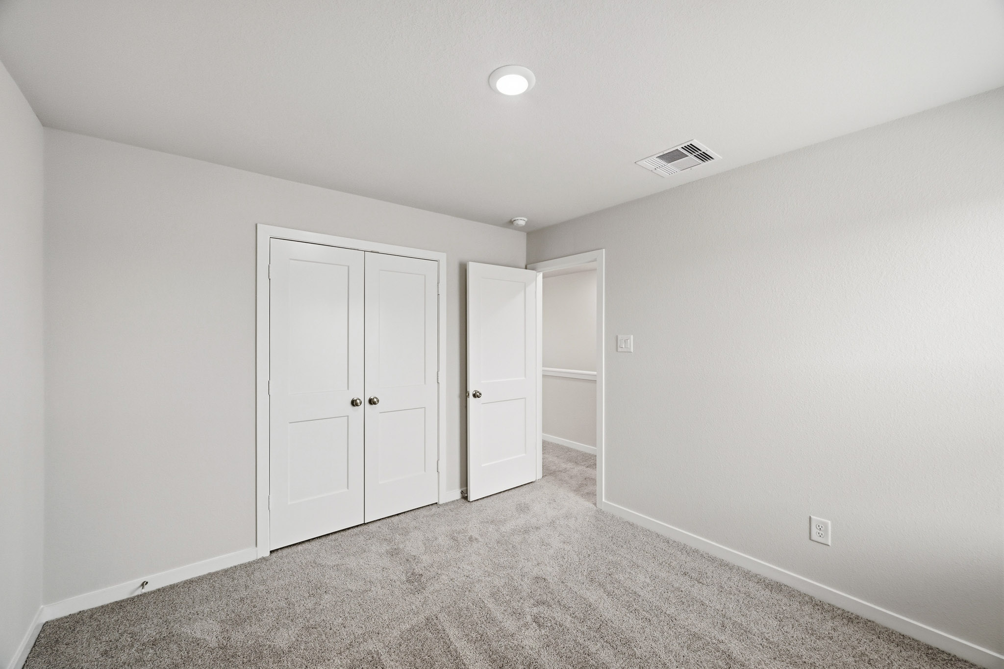 A room with white doors.