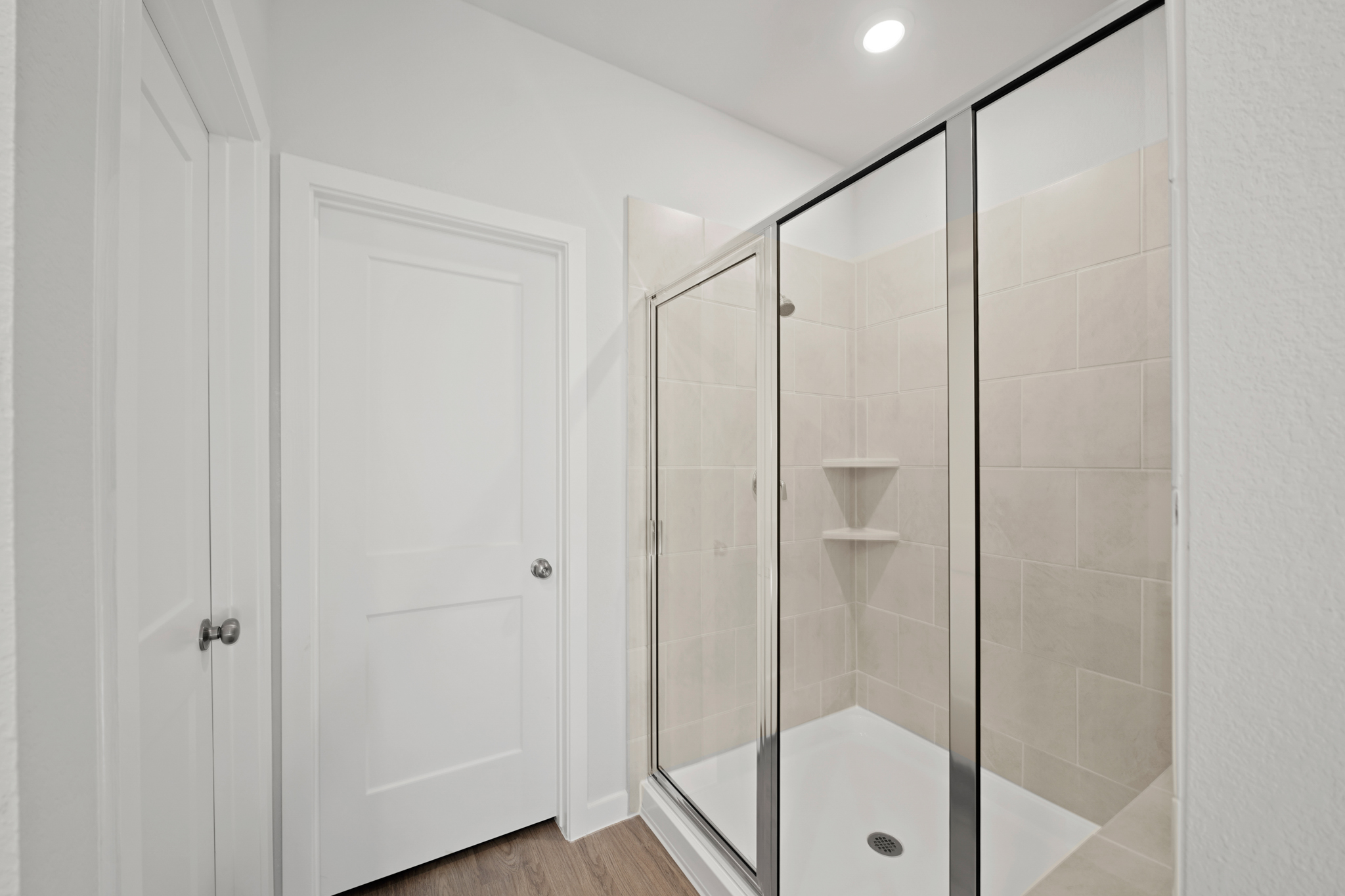 A bathroom with a glass shower.