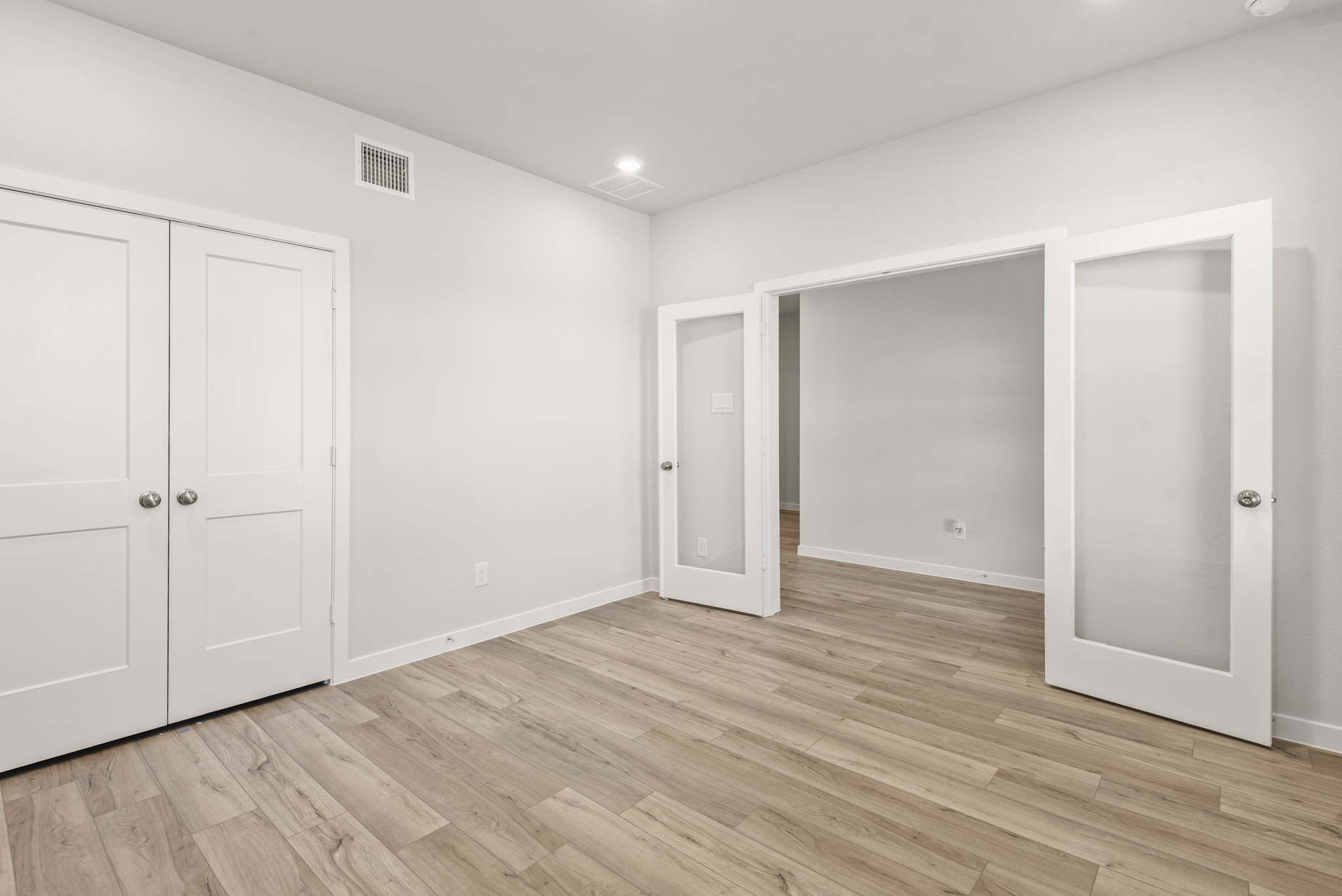 A room with white doors.