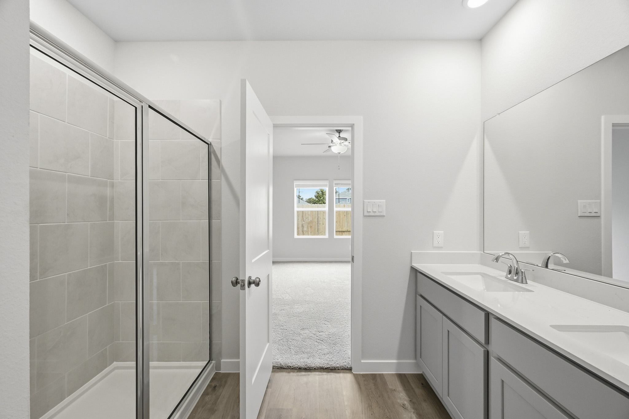 A bathroom with a glass shower.