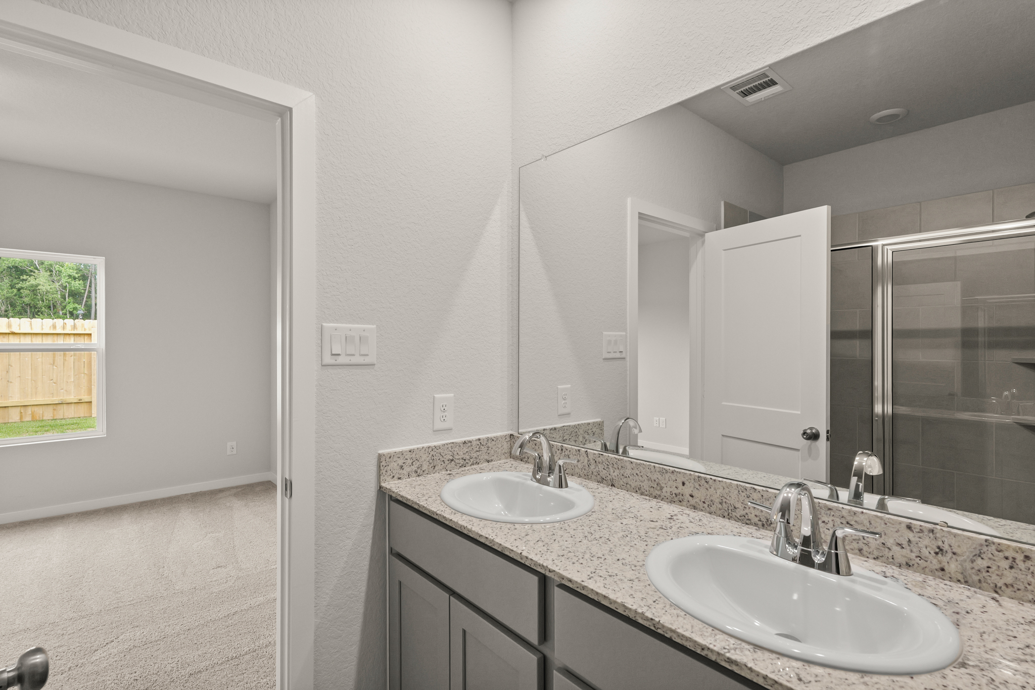 A bathroom with two sinks.