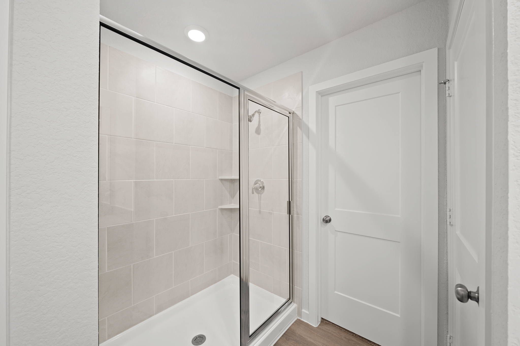 A bathroom with a glass shower.
