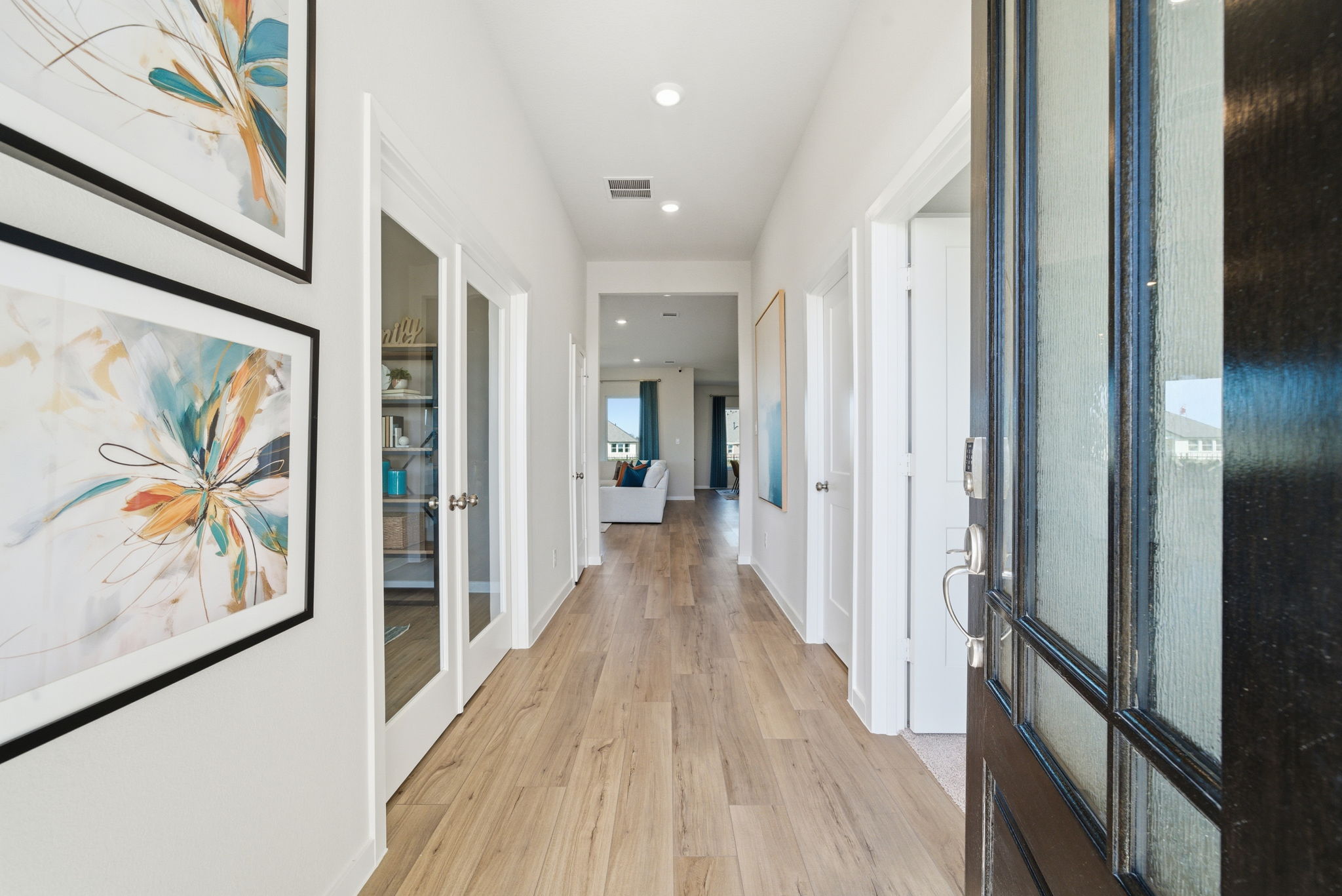 A hallway with white walls.