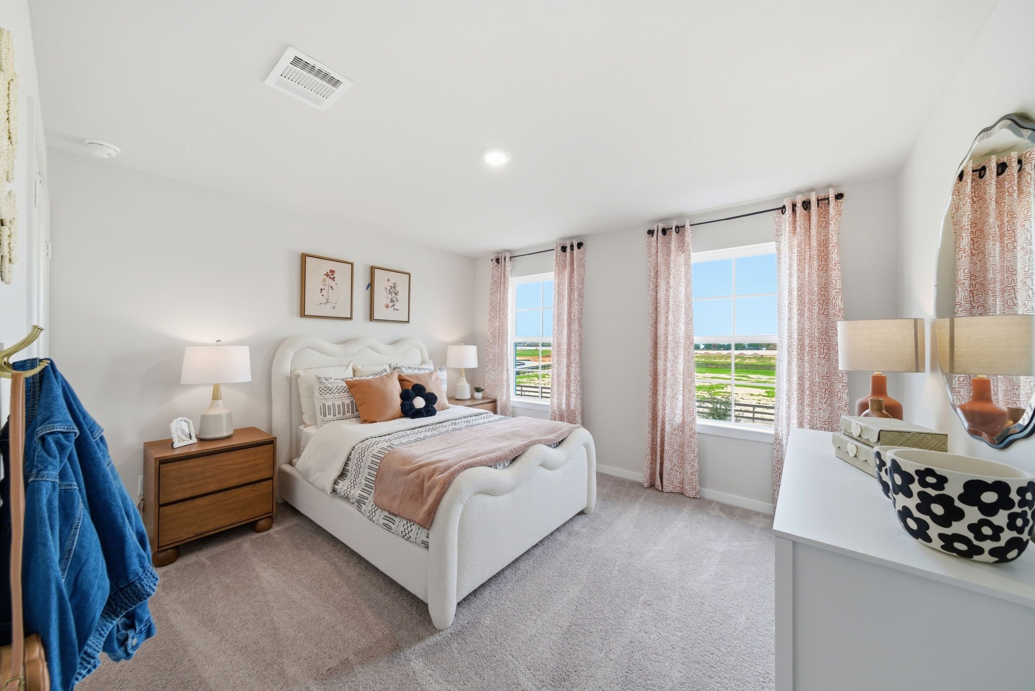 A bedroom with a large window.