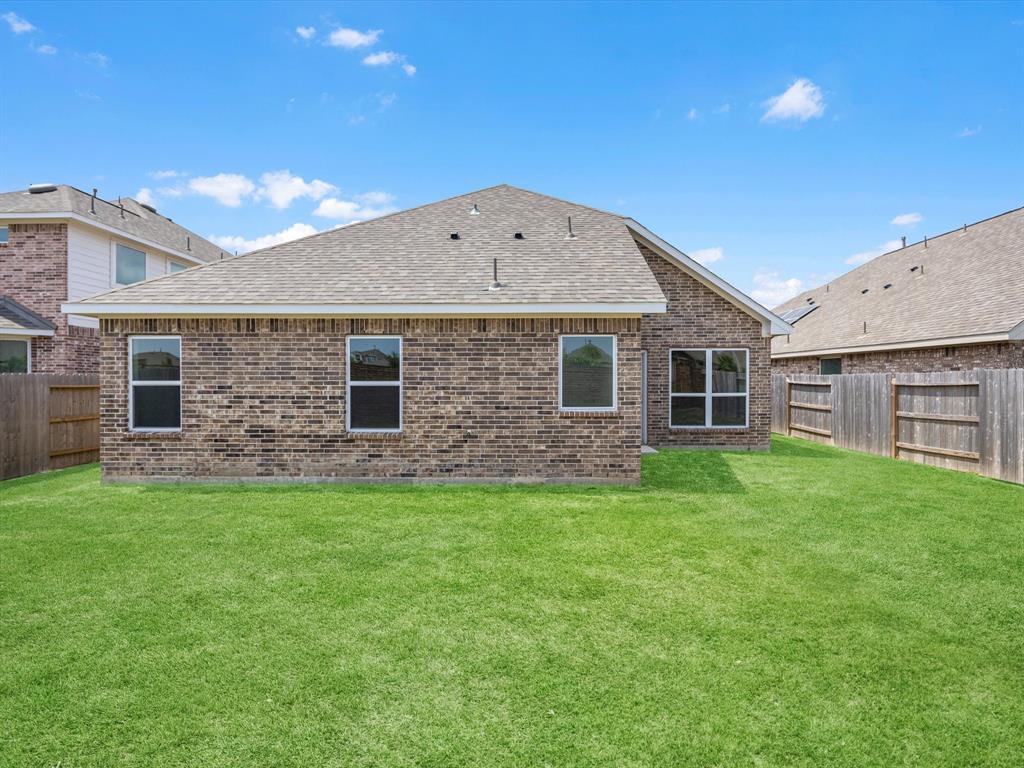 A house with a grass yard.