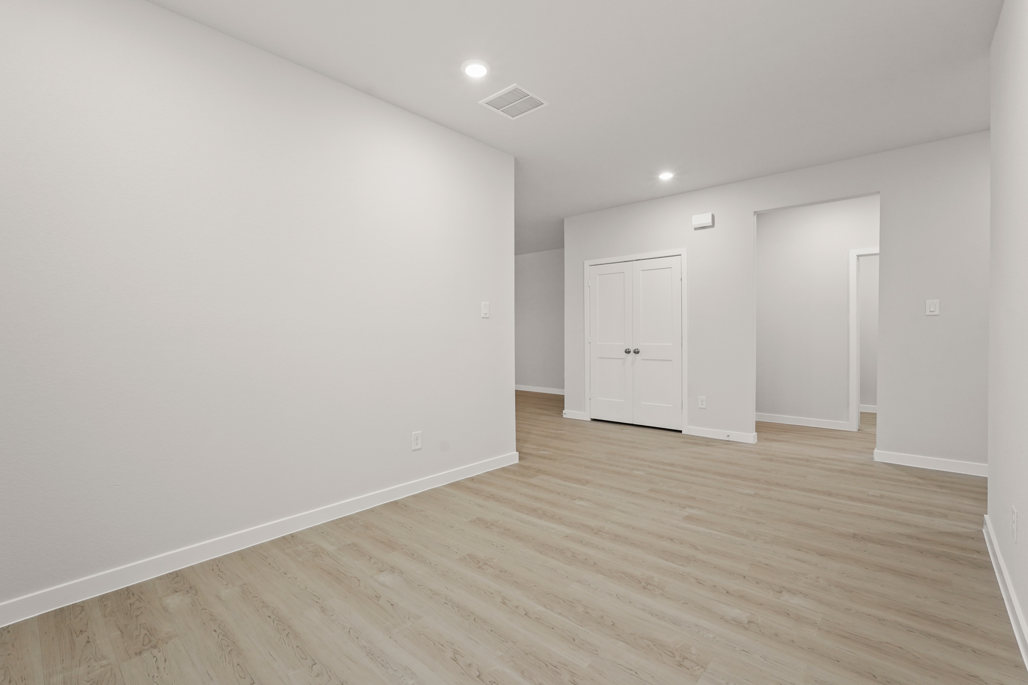 A room with white cabinets.