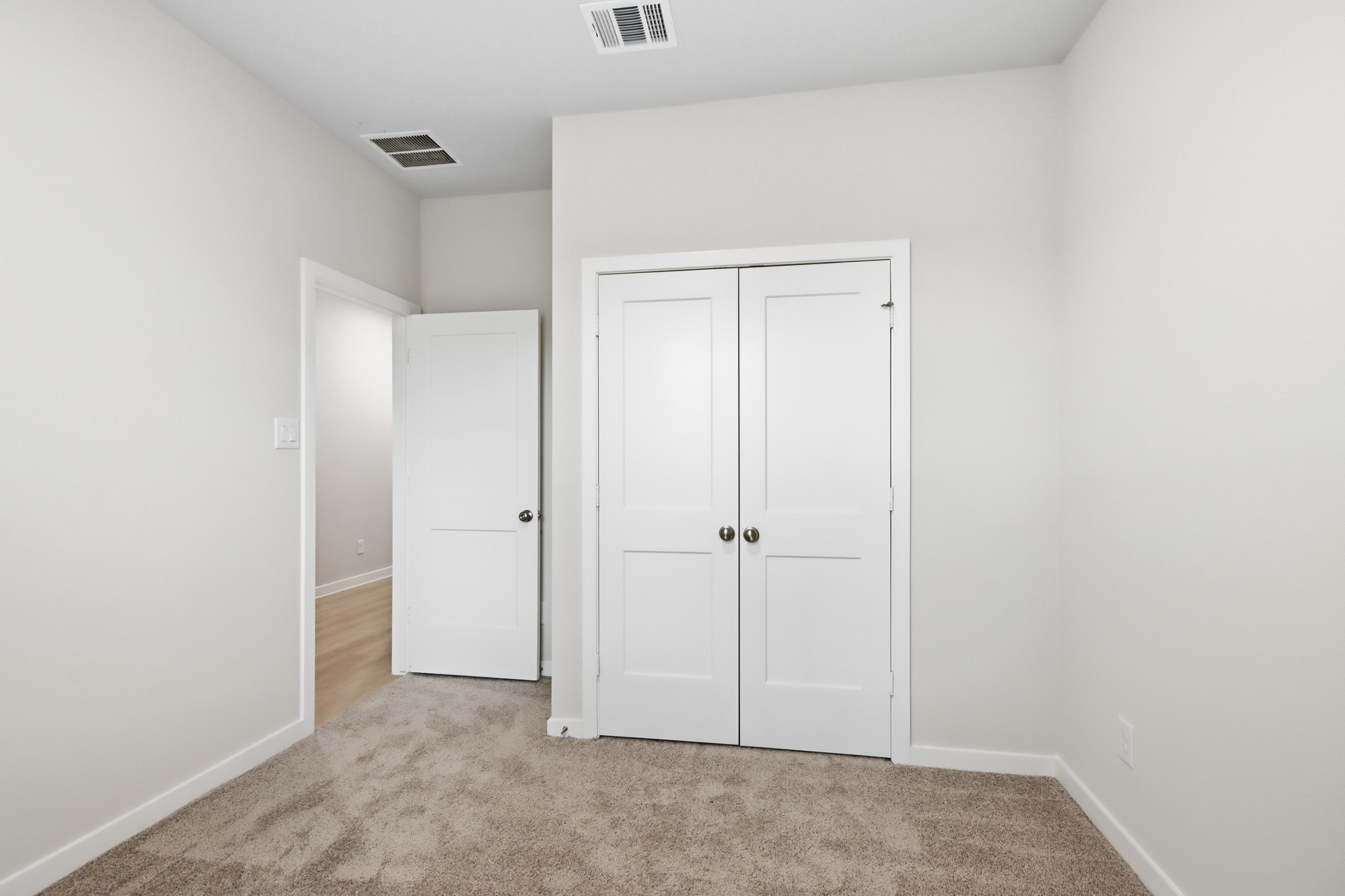 A room with white doors.