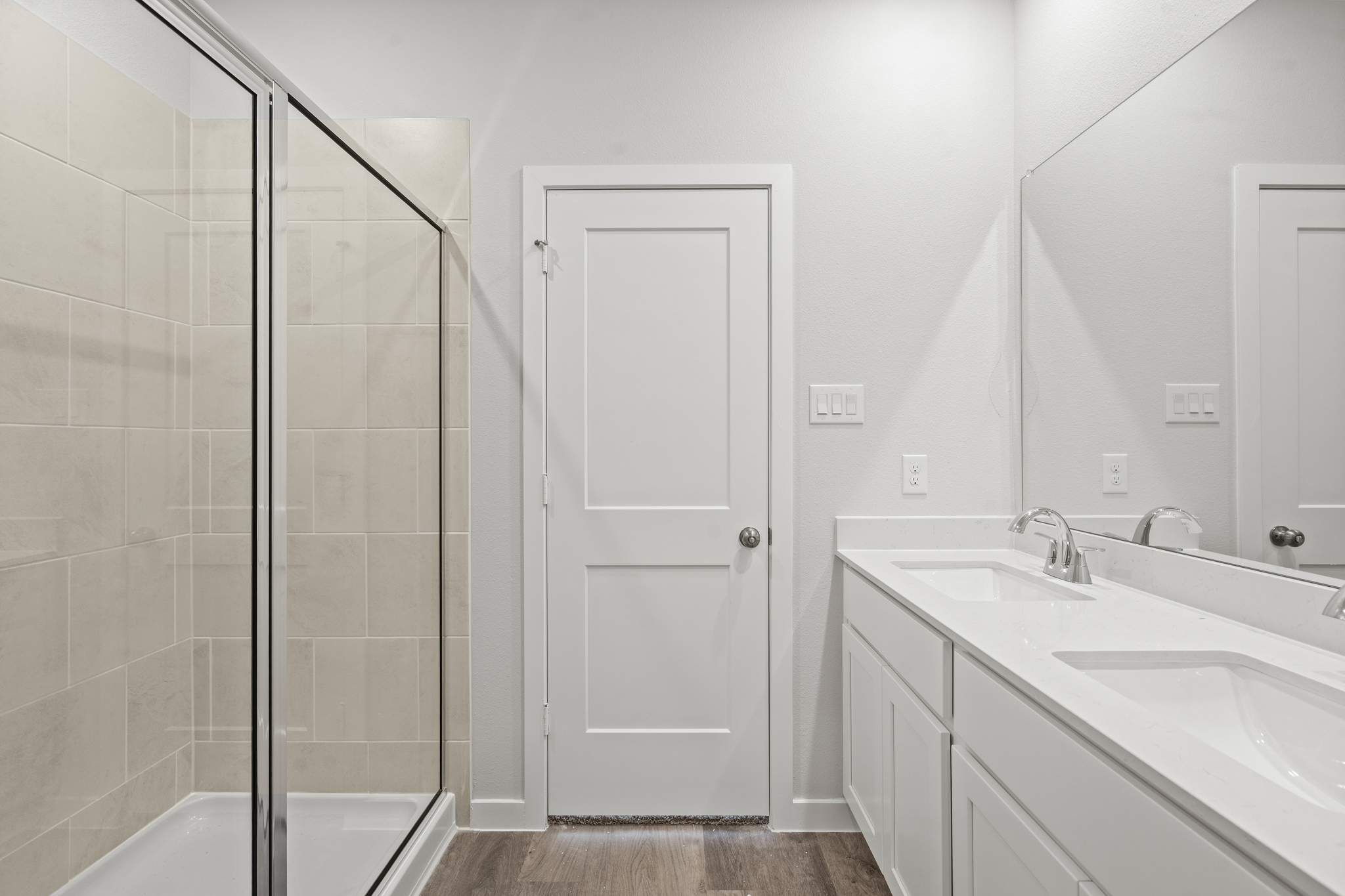 A bathroom with a glass shower.