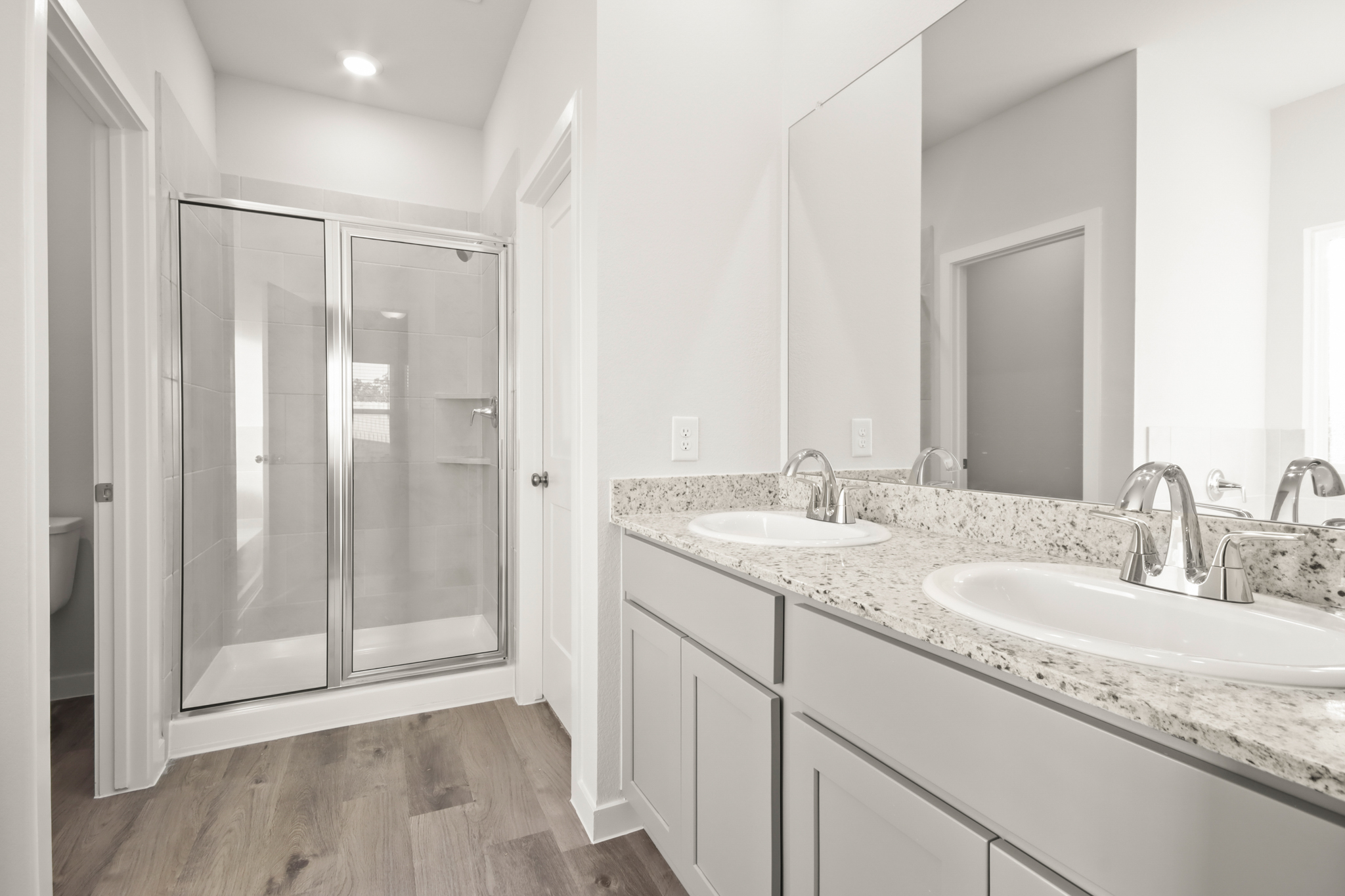 A bathroom with a glass shower.