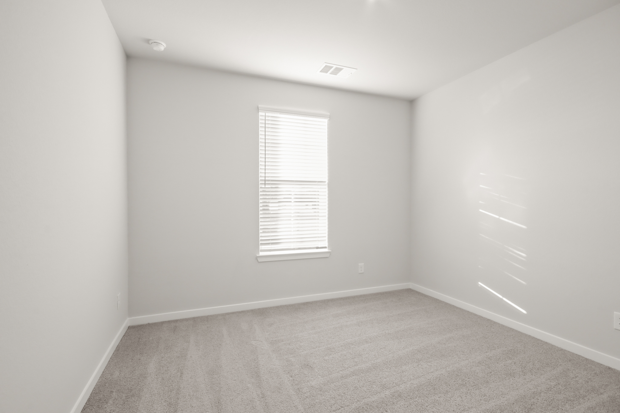 A room with a door and a window.