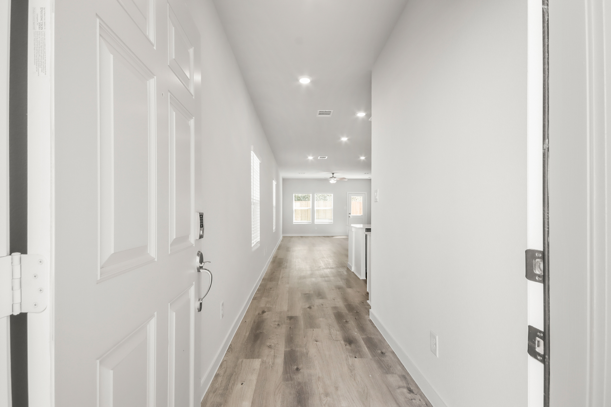 A hallway with white doors.