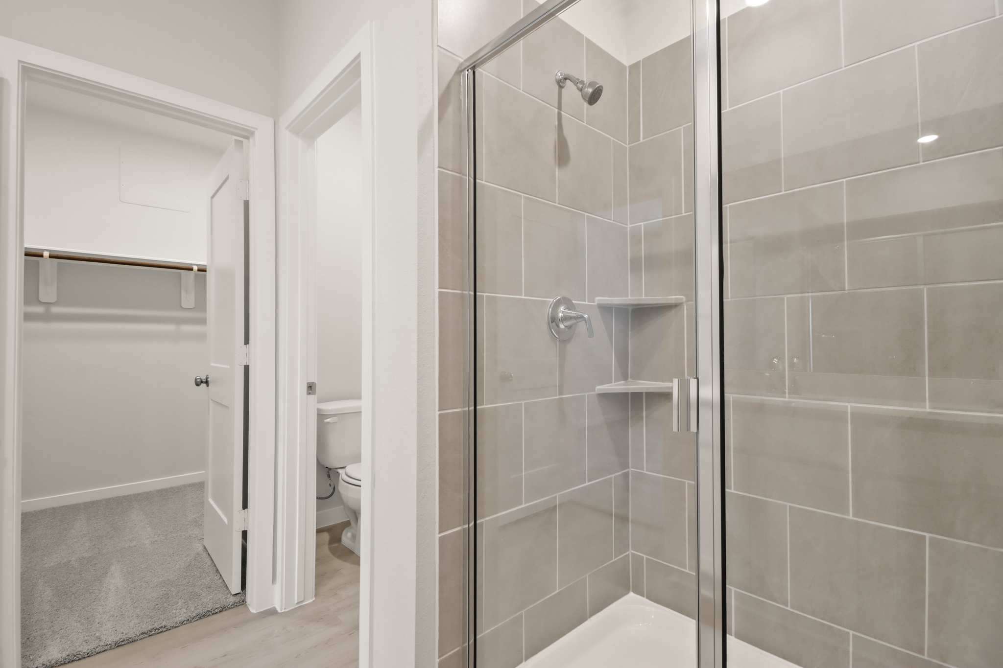 A bathroom with a glass shower.