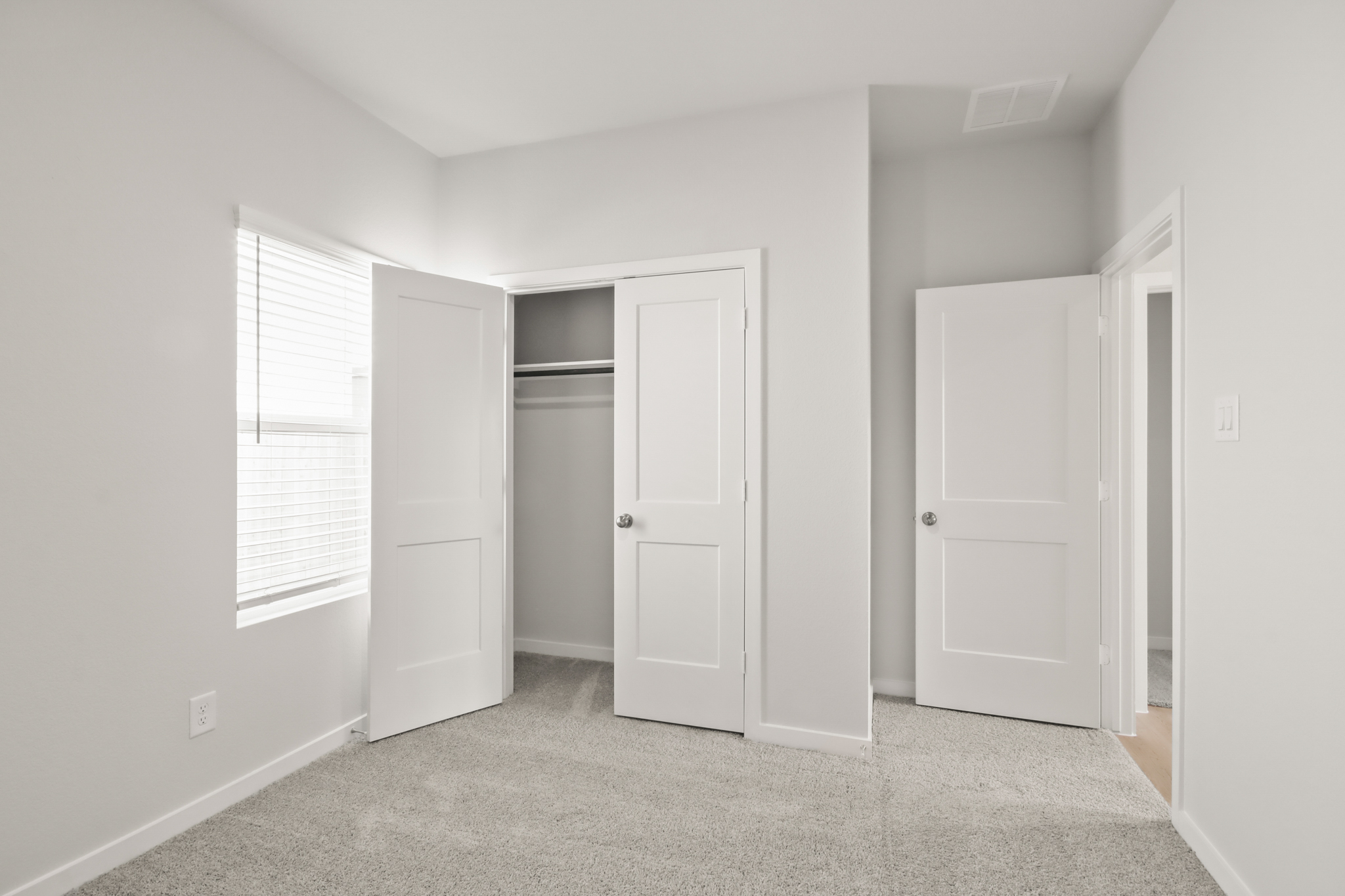 A room with white doors.