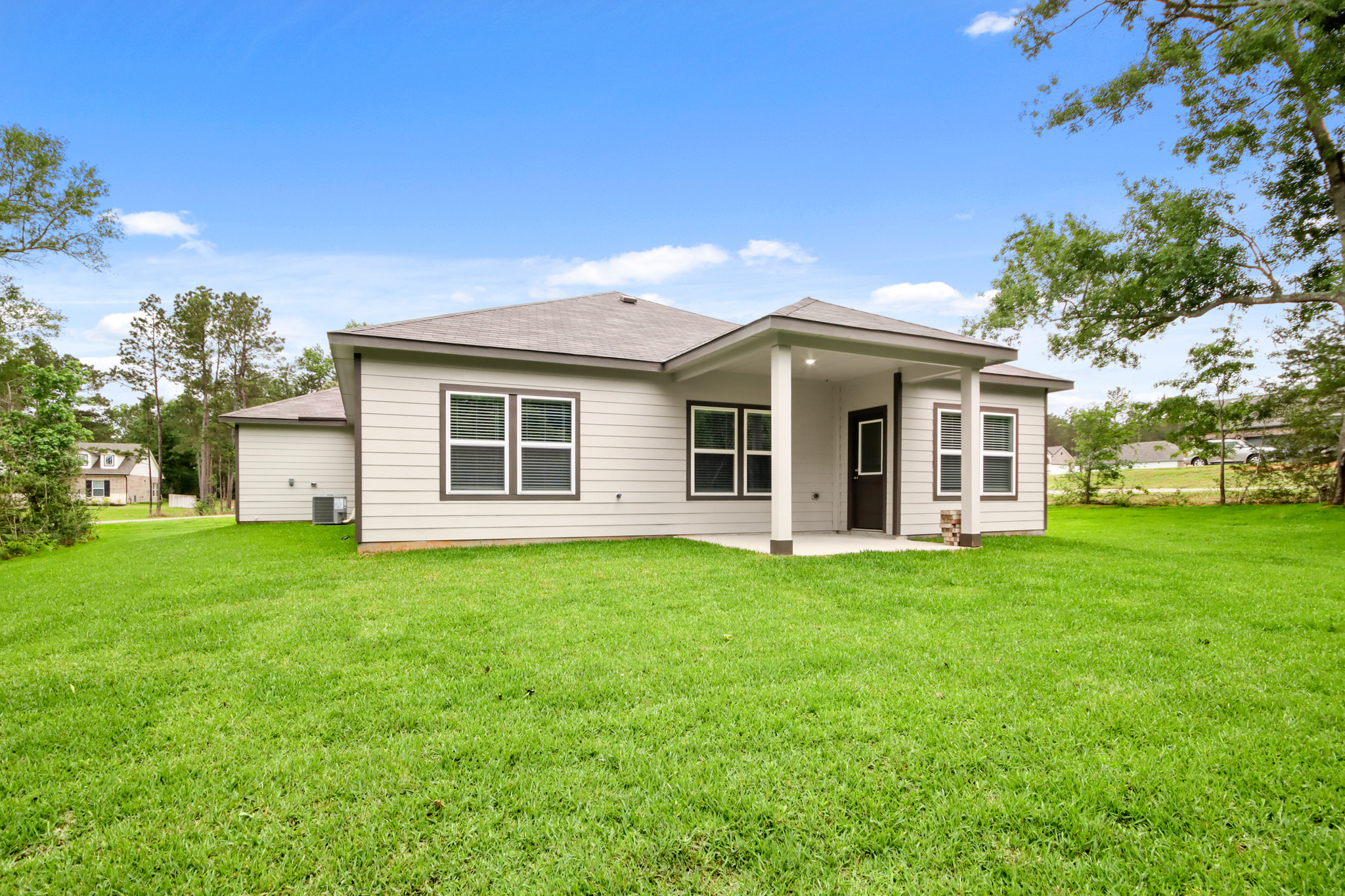 A house with a lawn in front of it.