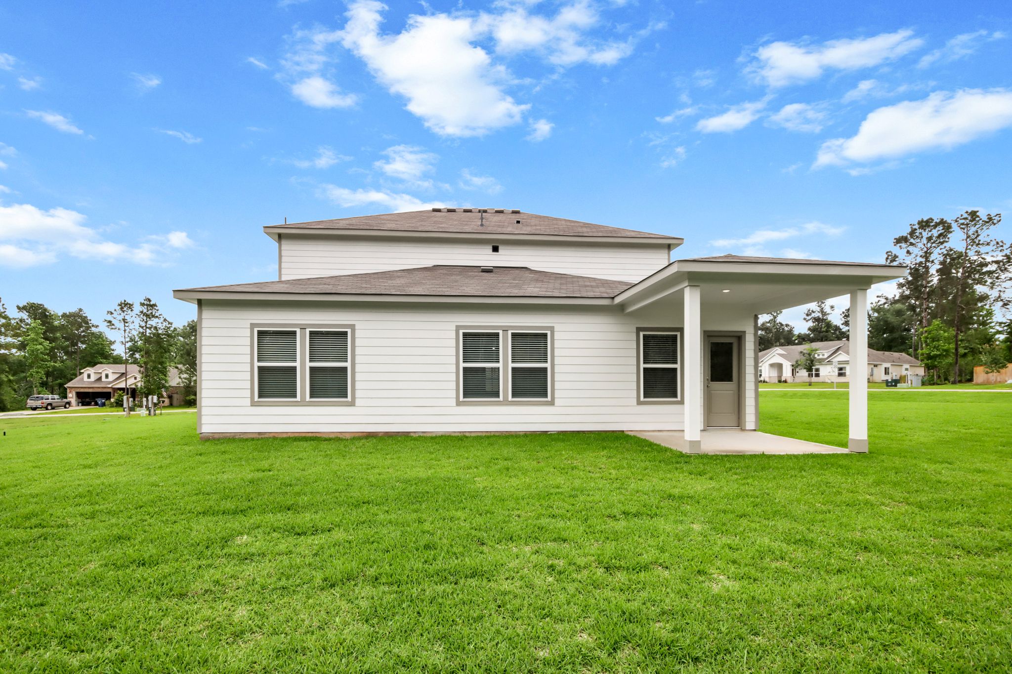A house with a lawn in front of it.