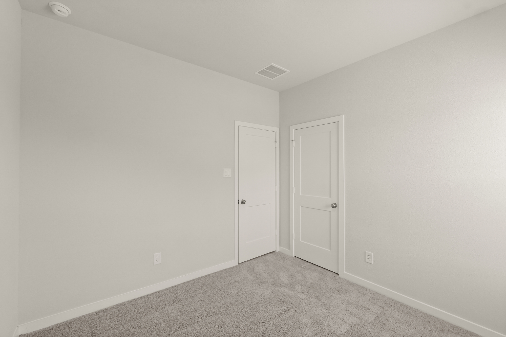 A room with white doors.