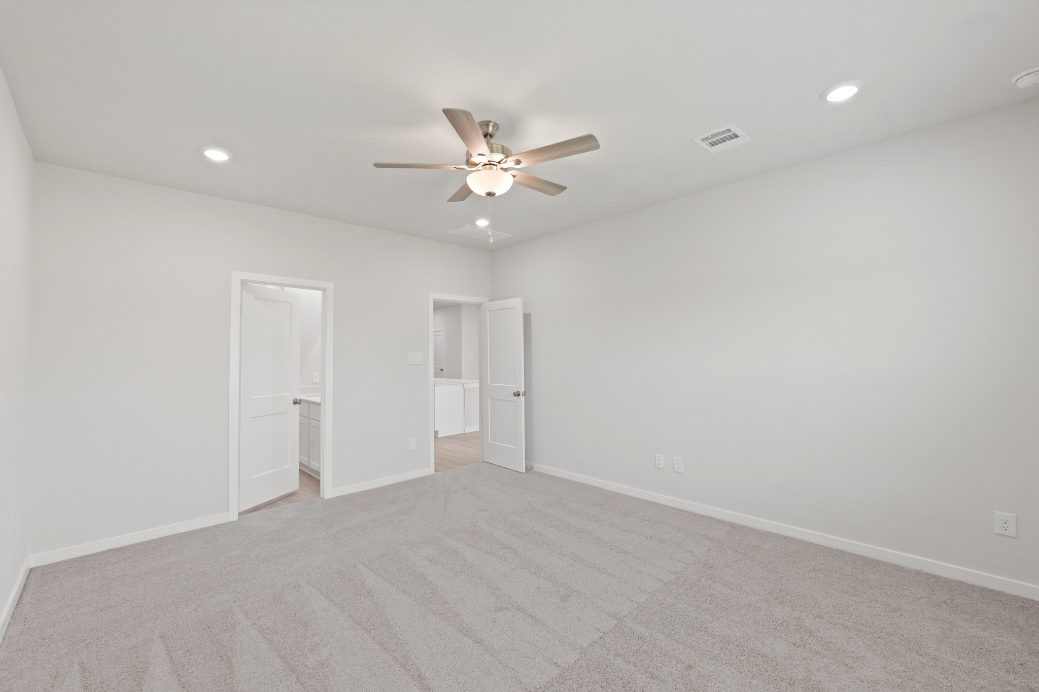 A room with a ceiling fan and a ceiling fan.