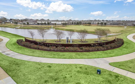A pond with a fountain in it.