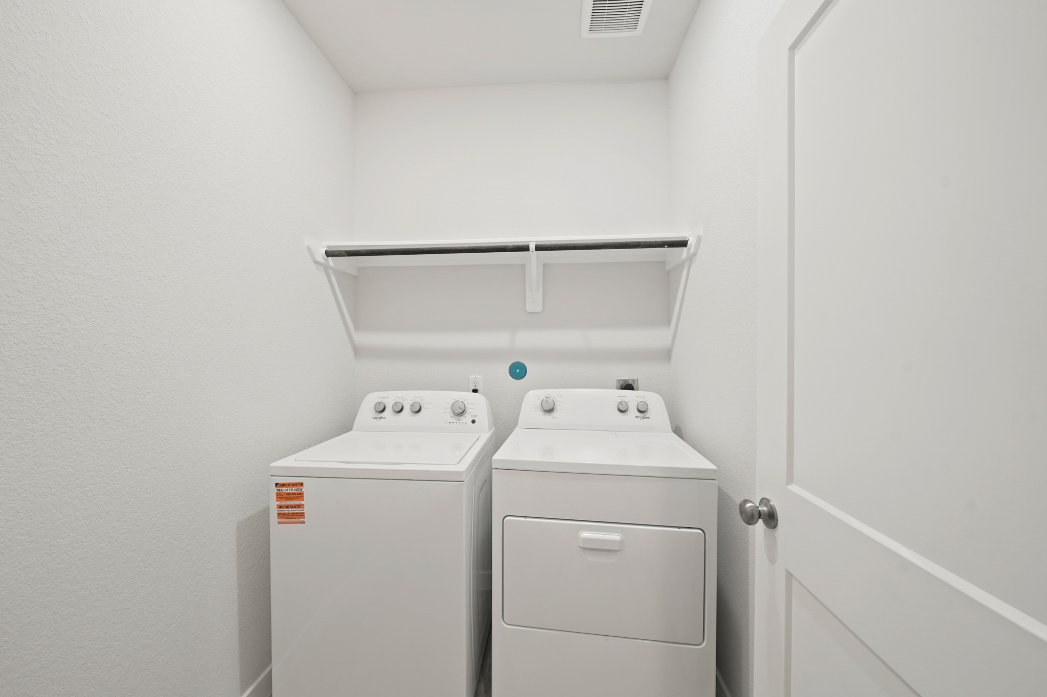 A washer and dryer in a room.