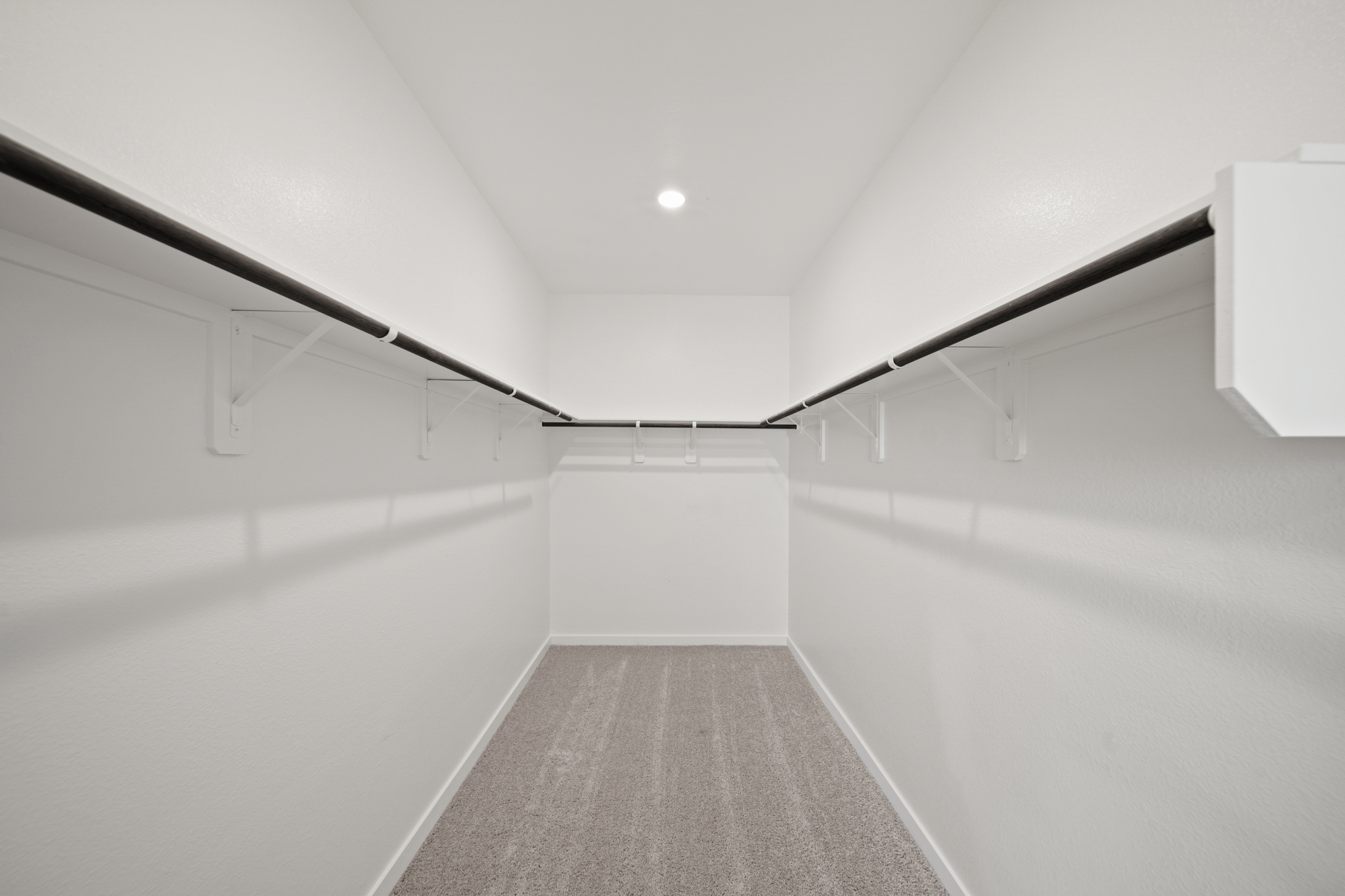 A hallway with white walls.