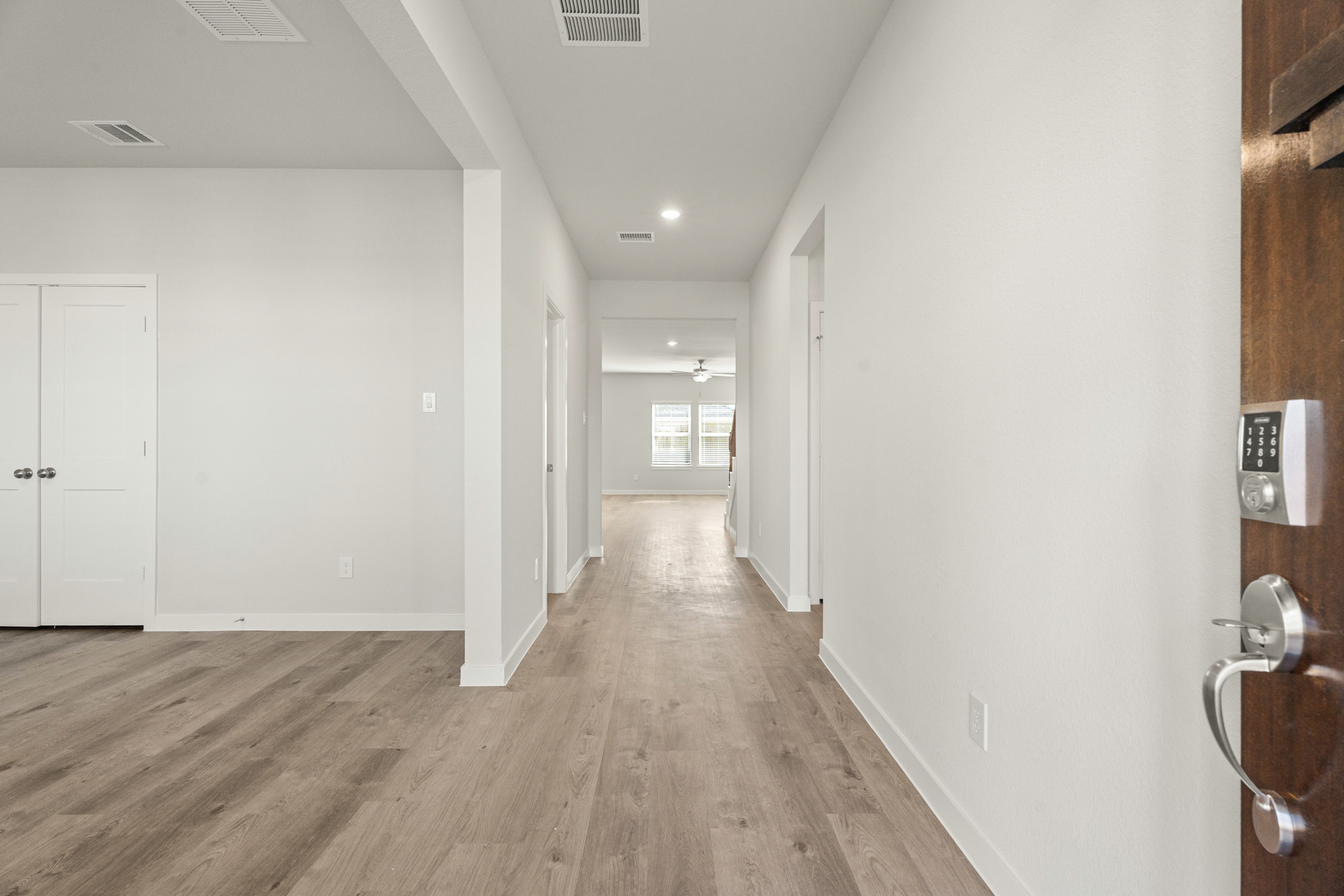 A hallway with white doors.