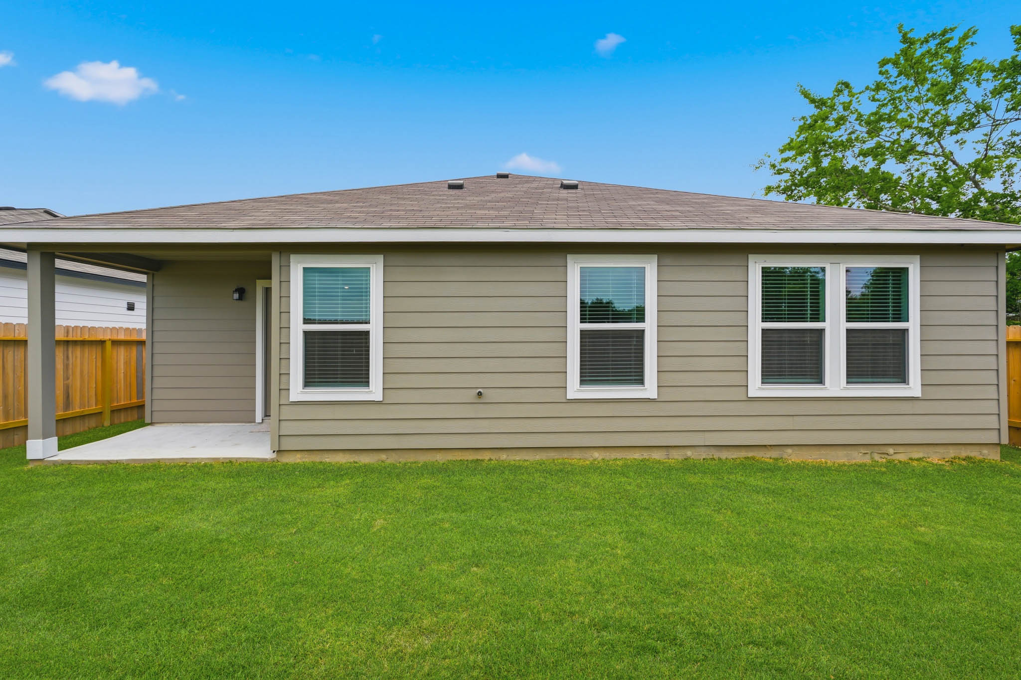 A house with a grass yard.