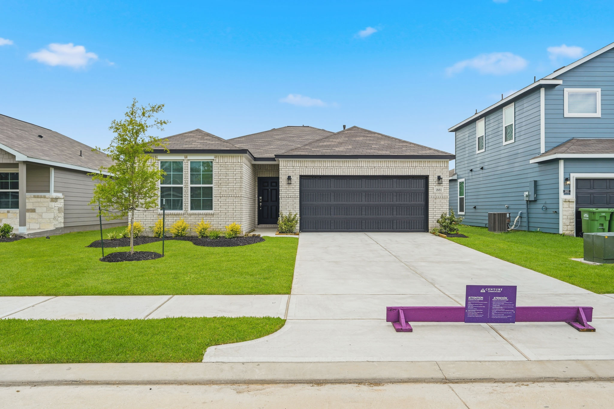 A driveway leading to a house.