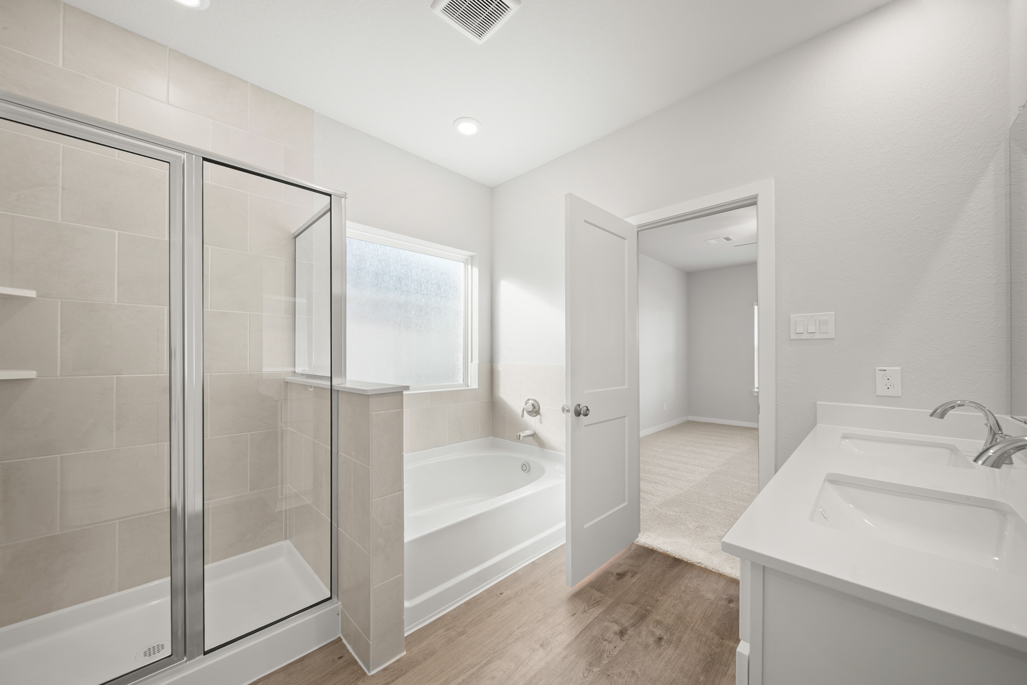 A bathroom with a glass shower.