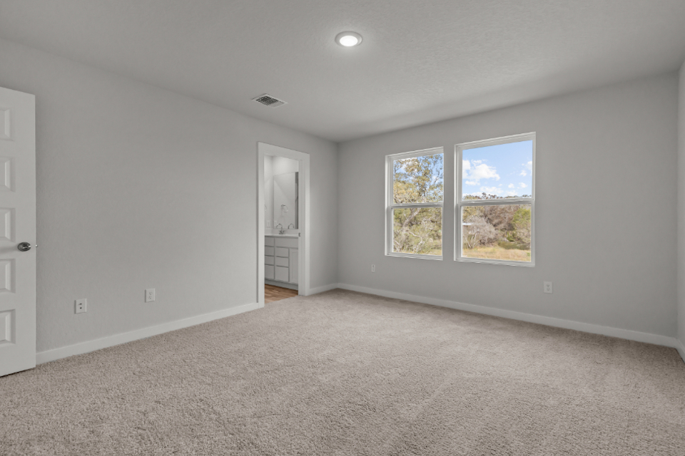 A room with a window and a door.