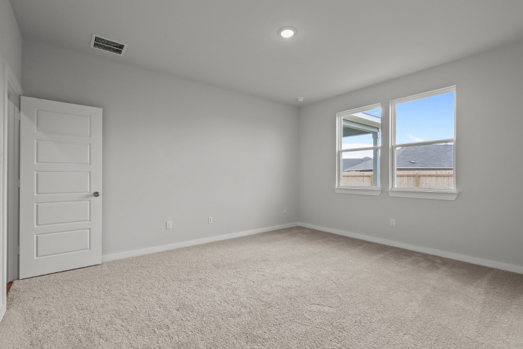 A room with a window and a door.