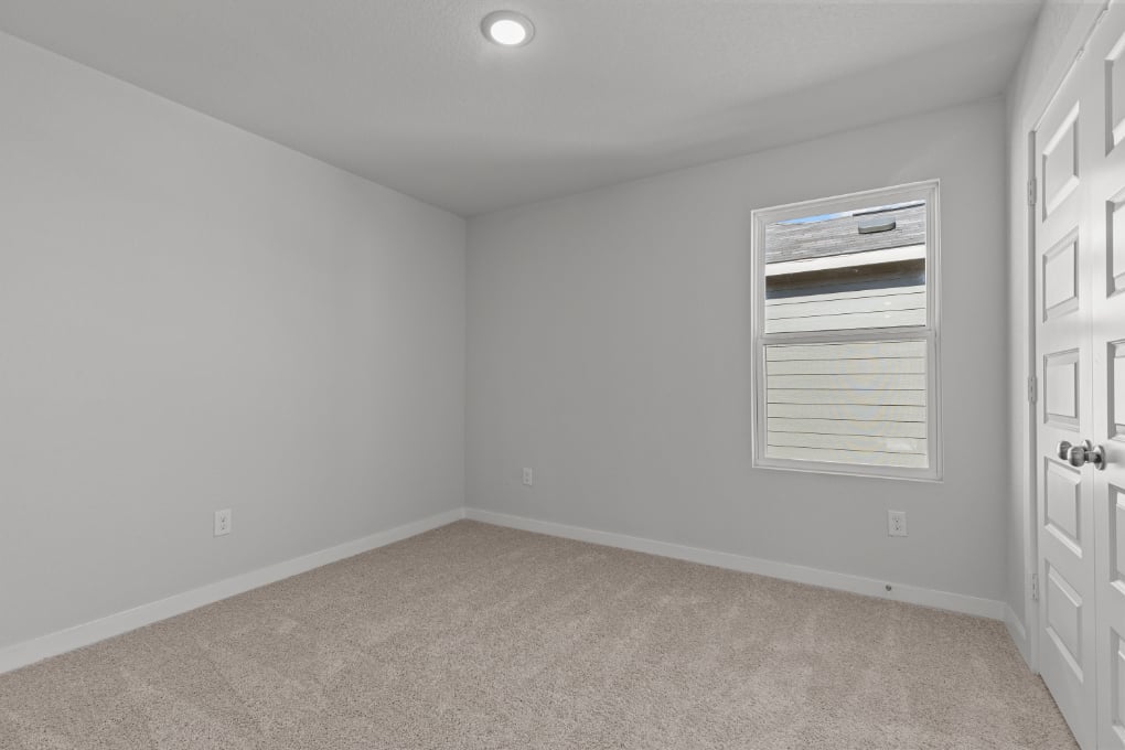 A room with a door and a window.