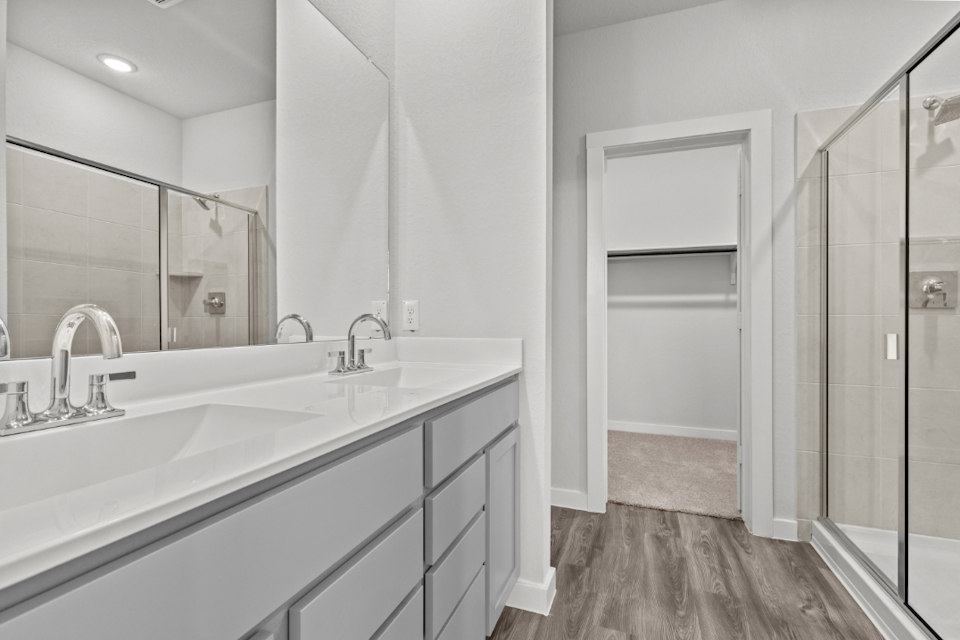A bathroom with a glass shower.