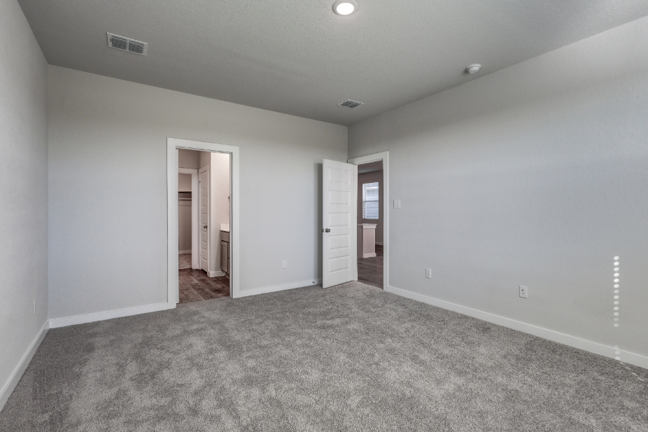 A hallway with white walls.