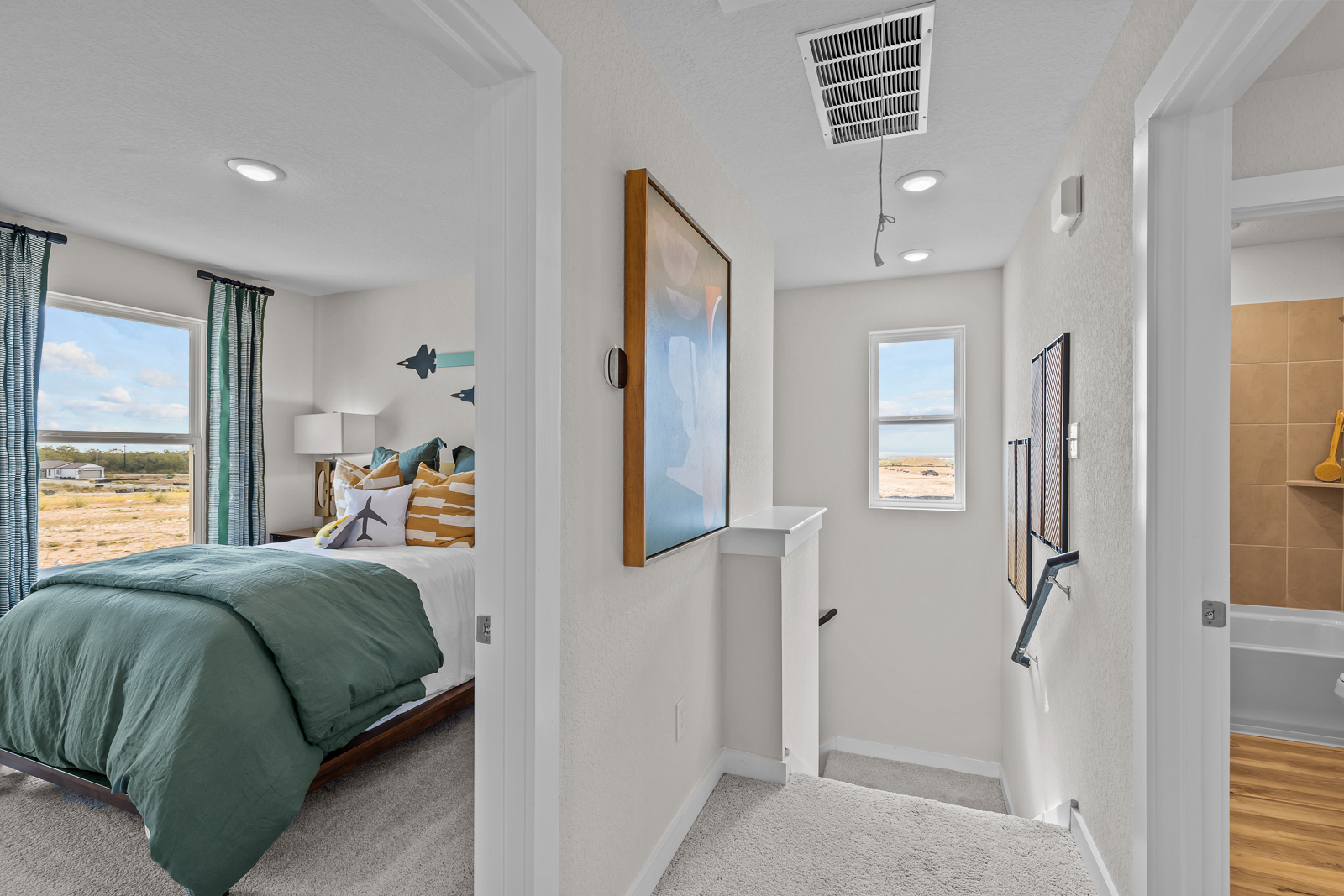 A bedroom with a bed and a window.