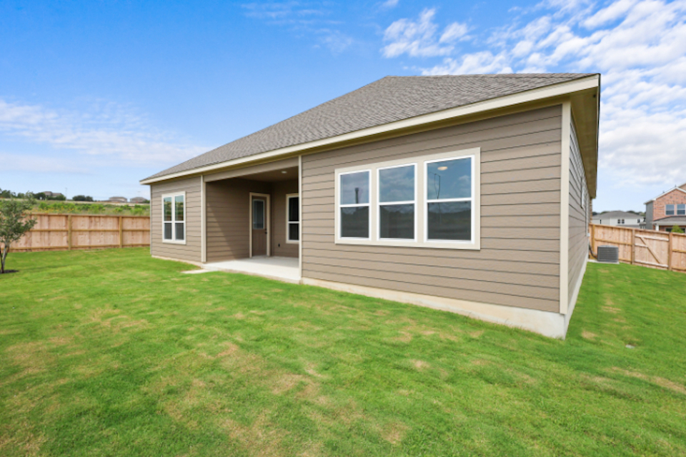A house with a grass yard.