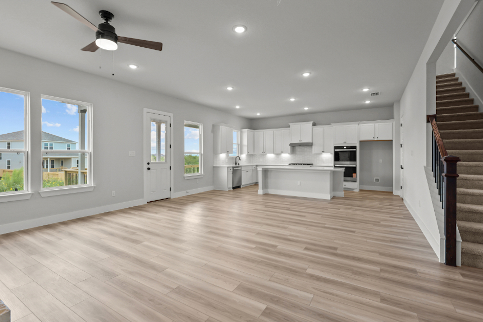 A large kitchen with white cabinets.