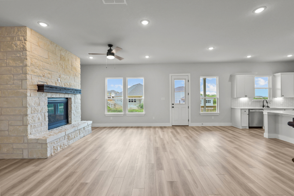 A kitchen with a fireplace.
