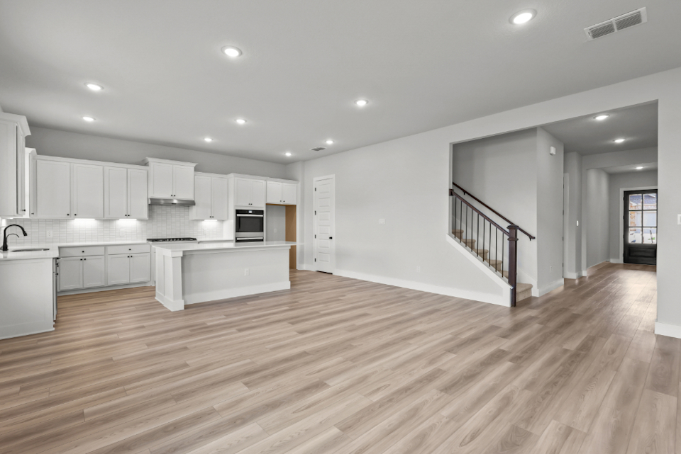 A large kitchen with white cabinets.