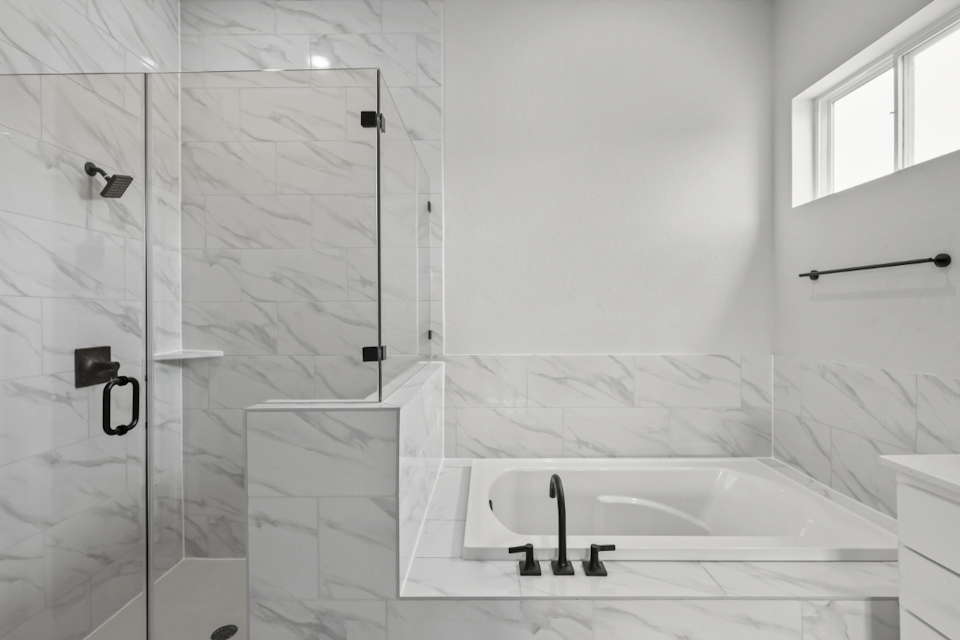 A bathroom with a glass shower.