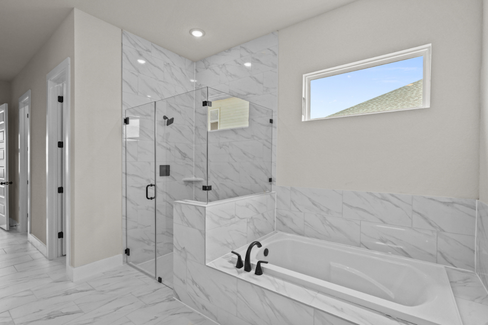 A bathroom with a glass shower.