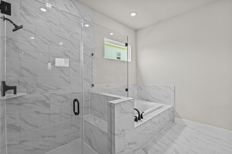 A bathroom with a glass shower.