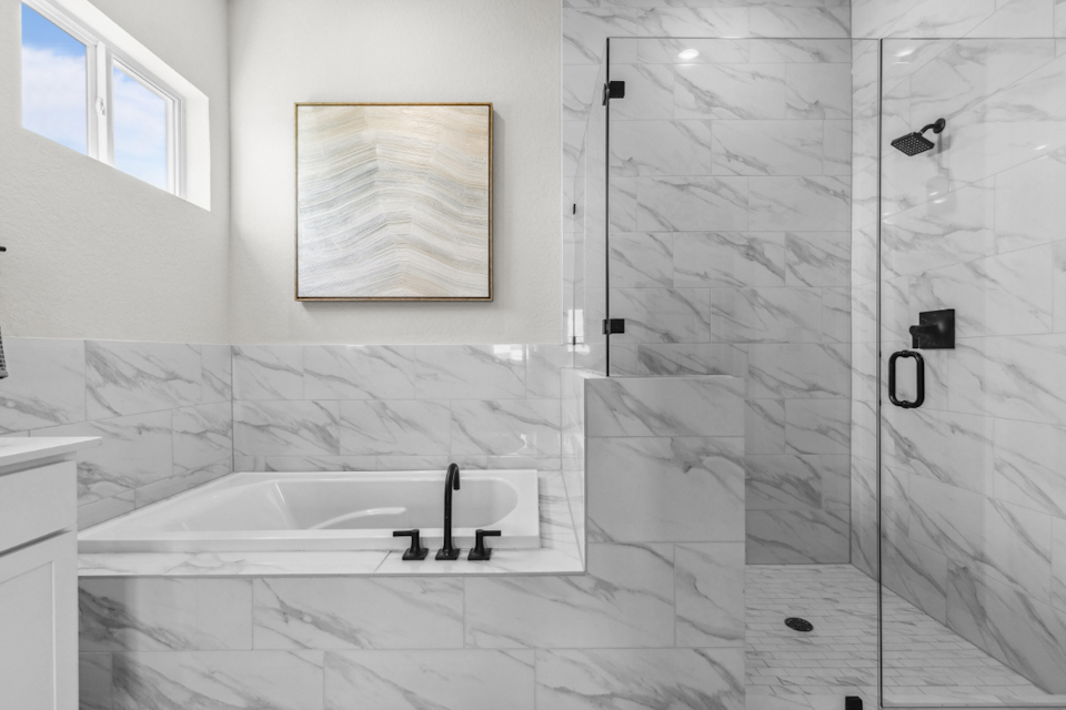 A bathroom with a glass shower.