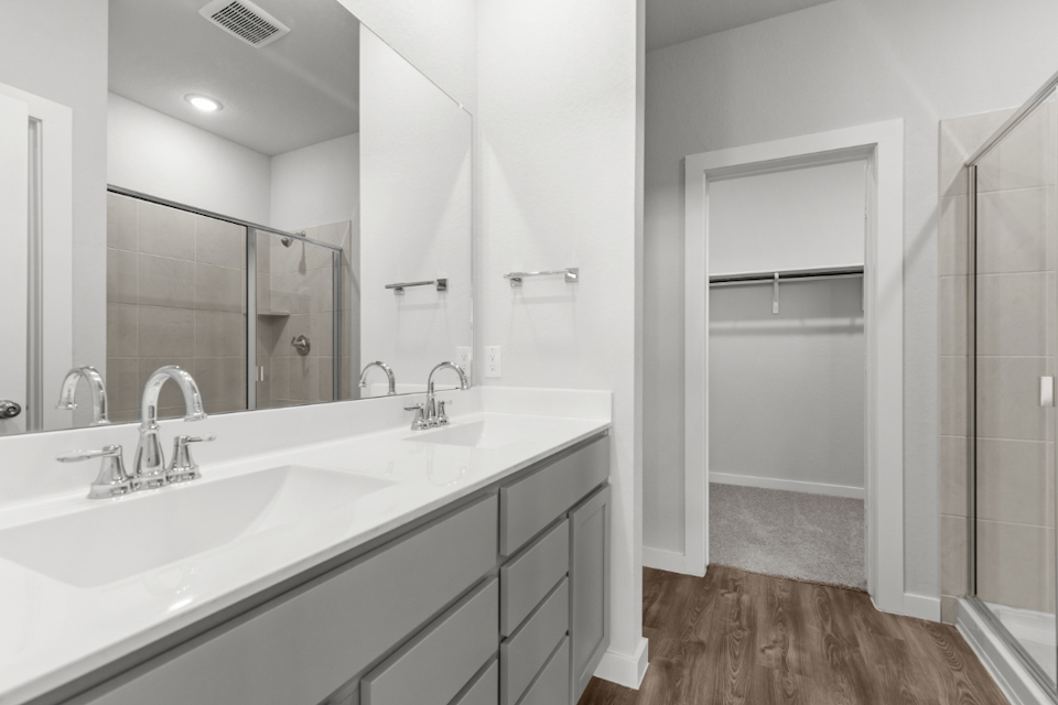 A bathroom with a glass shower.