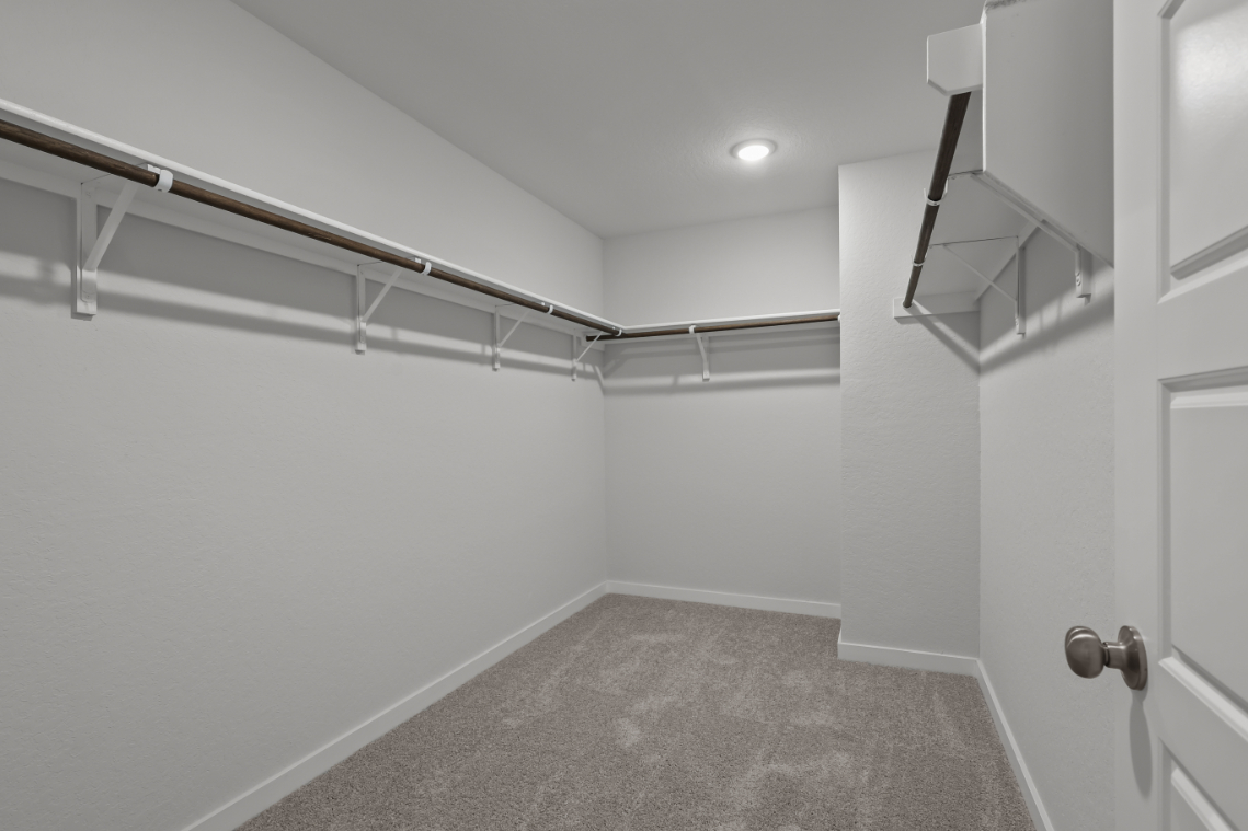 A hallway with white walls.